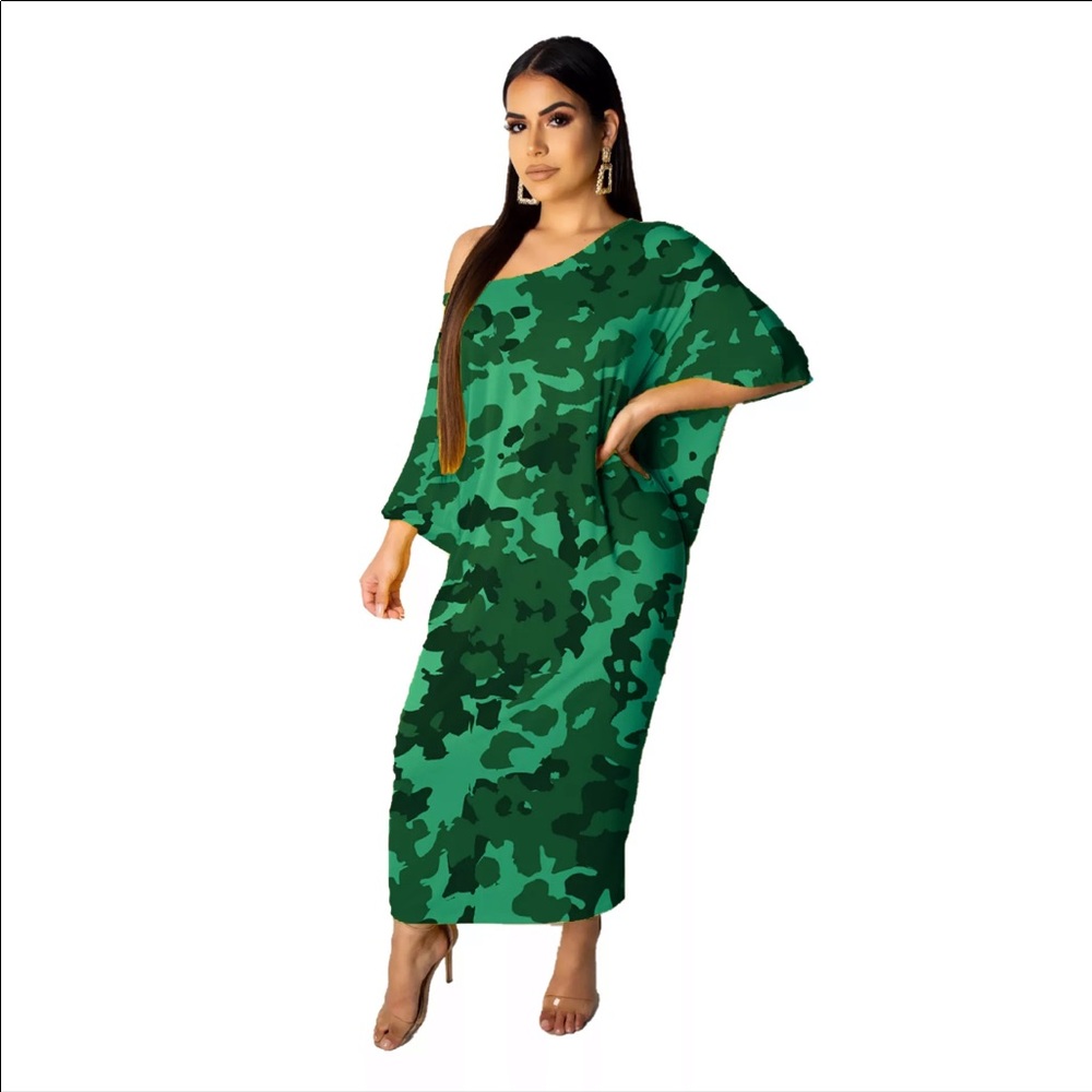 Beautiful green collarless dress off the shoulder